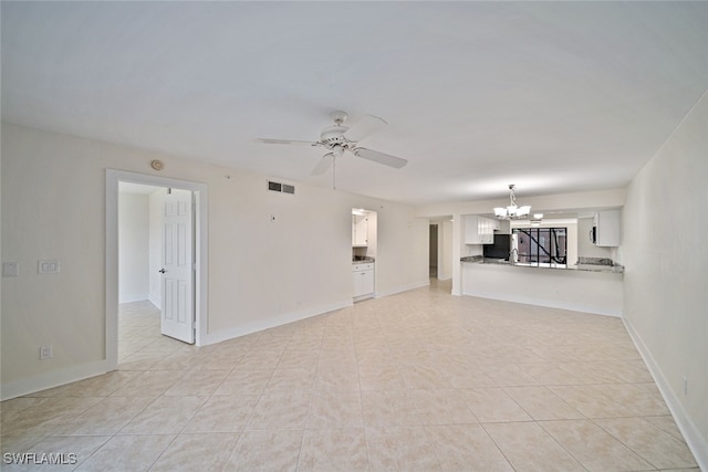 unfurnished living room with light tile patterned floors and ceiling fan with notable chandelier