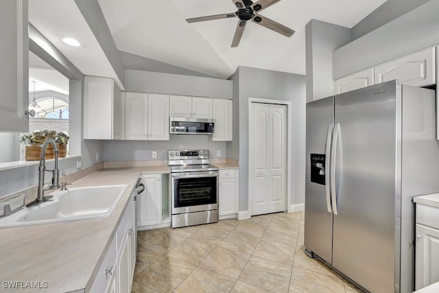 kitchen with white cabinetry, stainless steel appliances, and sink