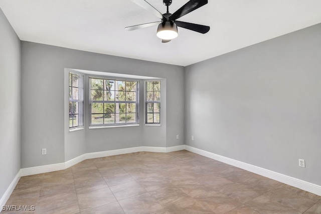 spare room with ceiling fan