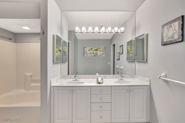 bathroom featuring vanity and bathtub / shower combination