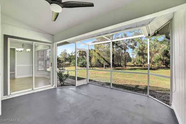 unfurnished sunroom featuring lofted ceiling and ceiling fan