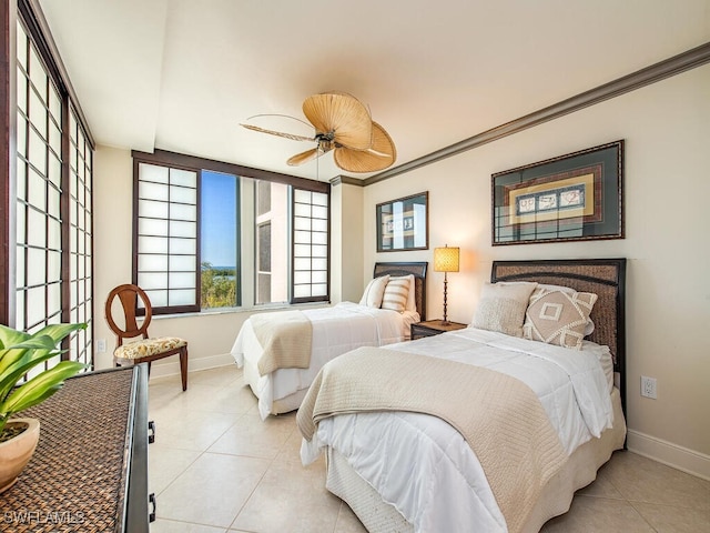 bedroom with ceiling fan, light tile patterned floors, and crown molding