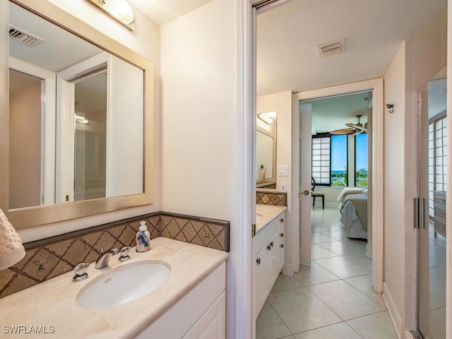 bathroom featuring ceiling fan, tile patterned flooring, and vanity