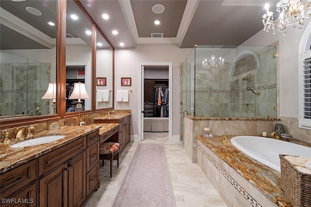 bathroom featuring an inviting chandelier, tile patterned flooring, crown molding, vanity, and independent shower and bath