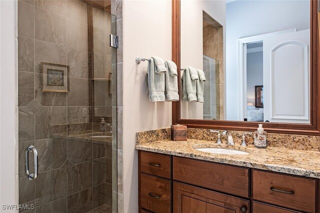 bathroom with vanity and an enclosed shower