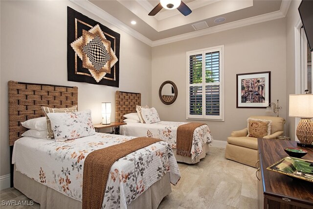 bedroom with ceiling fan, crown molding, and a tray ceiling