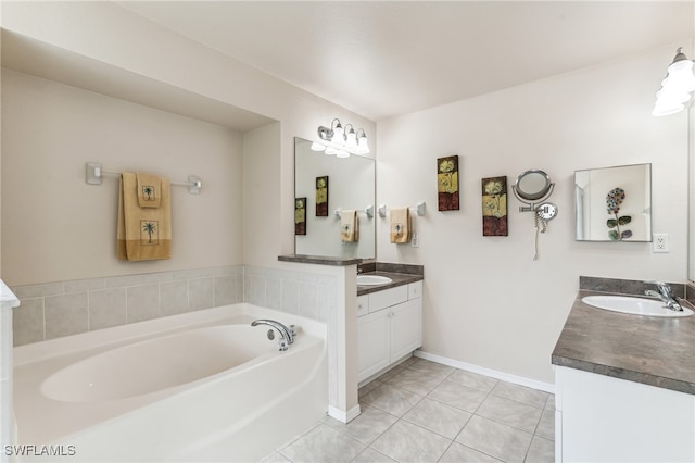 bathroom featuring a bath, tile patterned flooring, and vanity