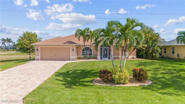 view of front of house featuring a garage and a front lawn