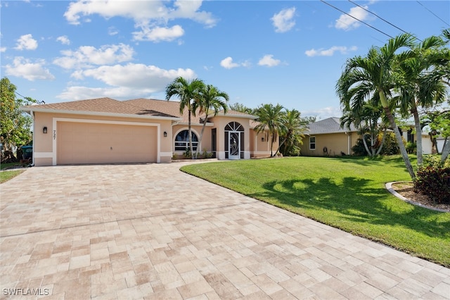 view of front of house featuring a front yard and a garage