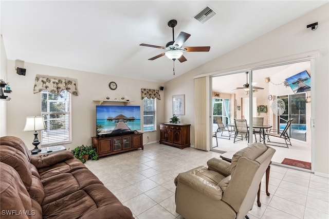 tiled living room with lofted ceiling and ceiling fan