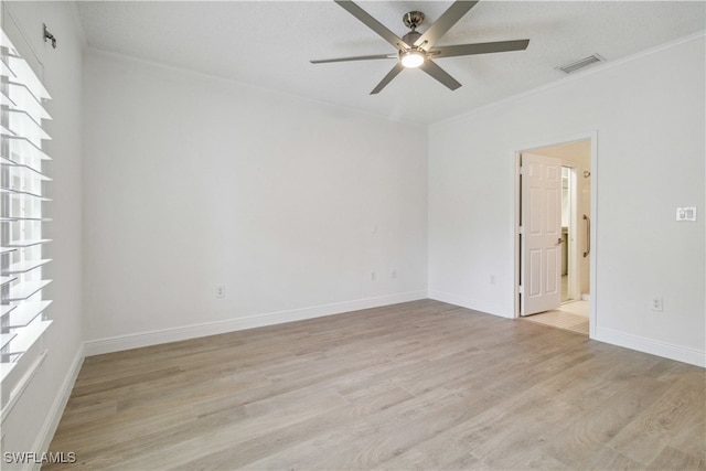 unfurnished room with crown molding, ceiling fan, light hardwood / wood-style floors, and a textured ceiling