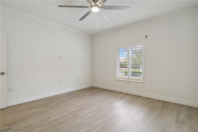 unfurnished room featuring ceiling fan, light hardwood / wood-style floors, and a textured ceiling