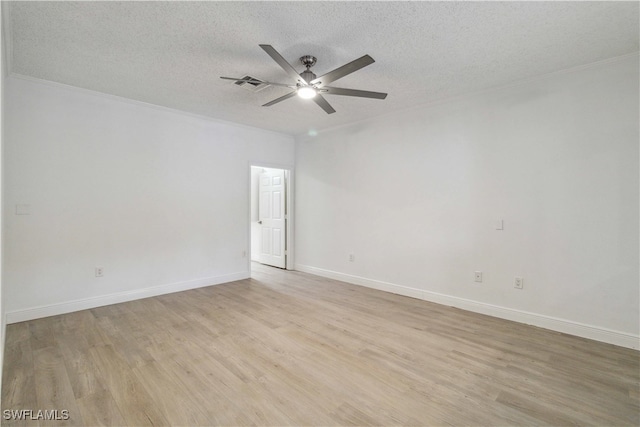 empty room with ceiling fan, crown molding, light wood-type flooring, and a textured ceiling