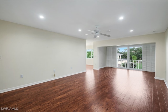 unfurnished room with dark wood-type flooring and ceiling fan