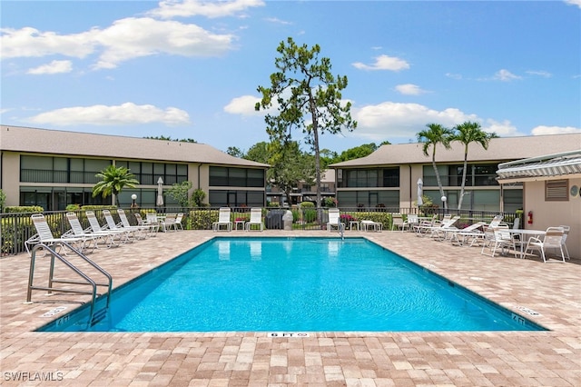 view of swimming pool featuring a patio area