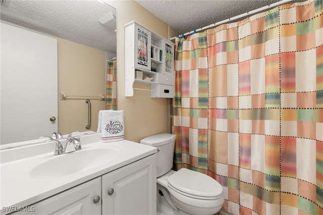 bathroom featuring curtained shower, vanity, a textured ceiling, and toilet