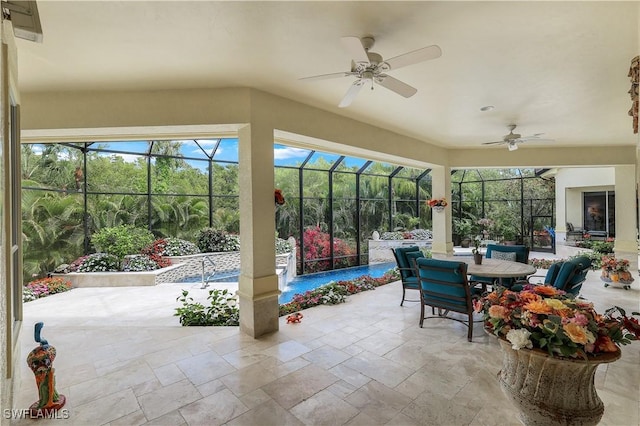 sunroom with ceiling fan