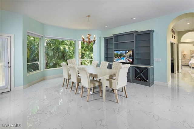 dining space featuring a notable chandelier