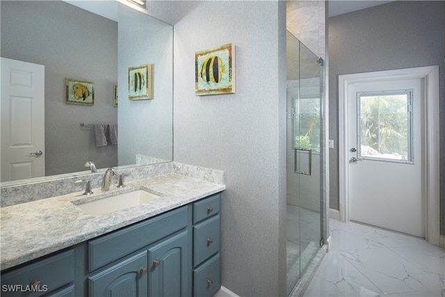 bathroom with an enclosed shower and vanity