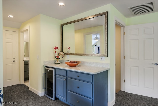 bathroom featuring vanity and wine cooler