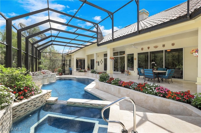 view of pool with a patio area, a lanai, ceiling fan, and an in ground hot tub