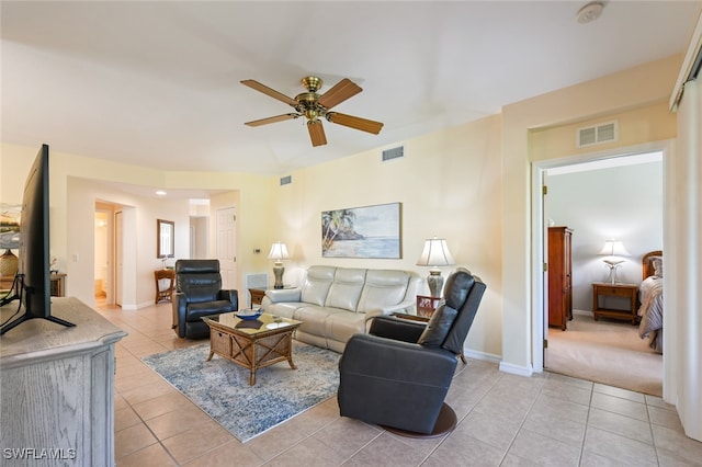 living room with ceiling fan and light tile patterned floors