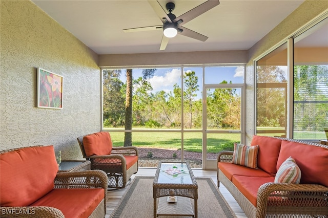 sunroom / solarium with plenty of natural light and ceiling fan