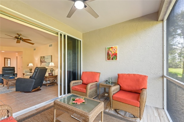 sunroom / solarium with ceiling fan