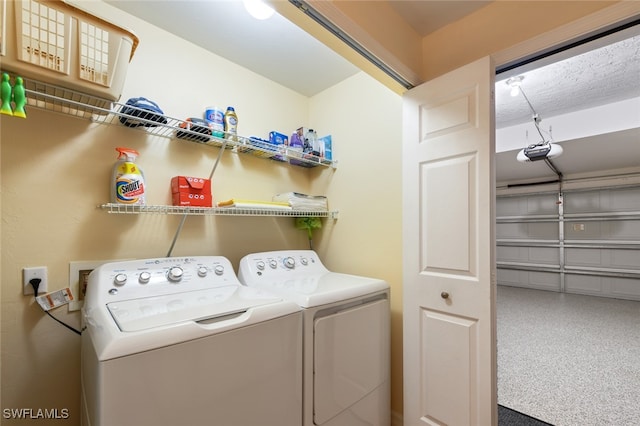 laundry room featuring washer and clothes dryer and carpet