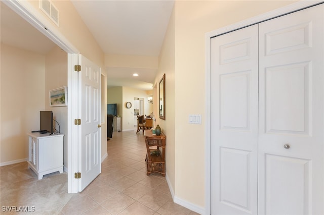 hallway with light tile patterned flooring