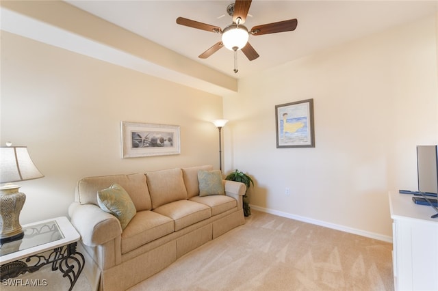 carpeted living room featuring ceiling fan