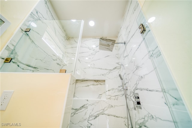 bathroom with tiled shower