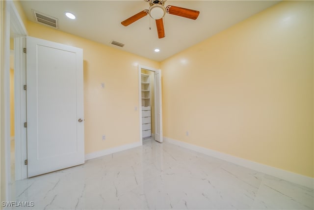 unfurnished room featuring ceiling fan