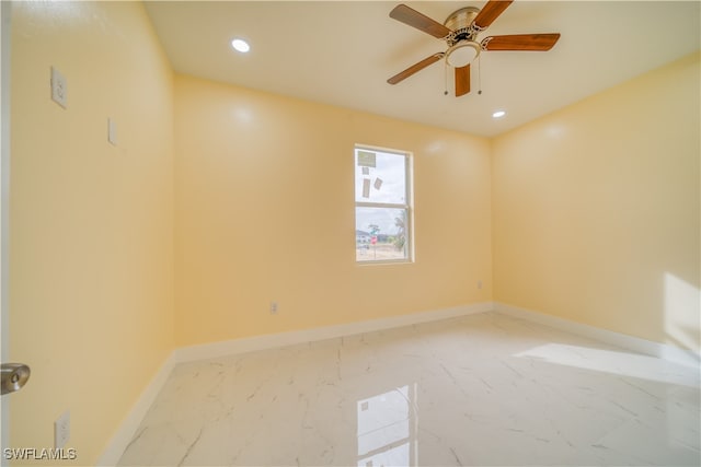 unfurnished room with ceiling fan