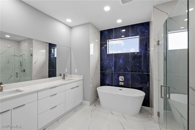 bathroom featuring tile walls, plenty of natural light, vanity, and plus walk in shower