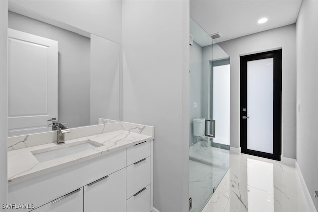 bathroom featuring walk in shower and vanity