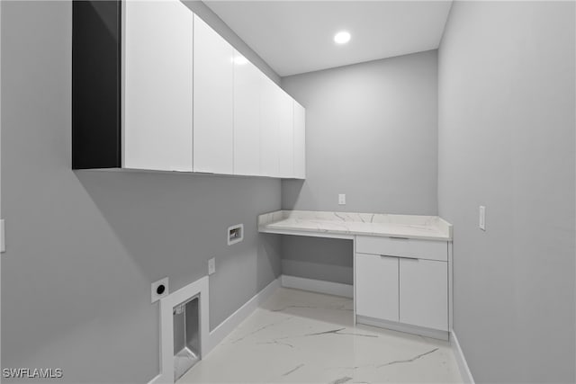 laundry room with cabinets, washer hookup, and hookup for an electric dryer