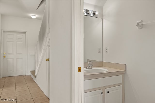 bathroom with tile patterned floors and vanity