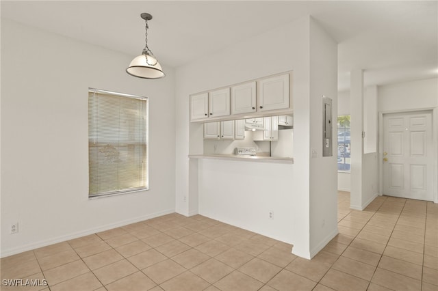 unfurnished dining area with light tile patterned floors