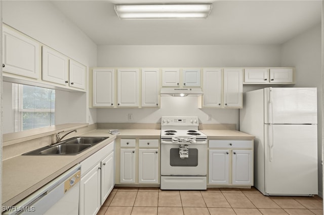 kitchen featuring light tile patterned floors, white appliances, white cabinetry, and sink