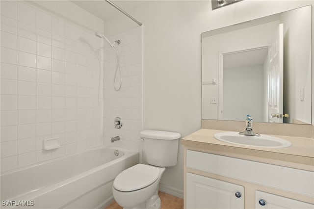 full bathroom with vanity, toilet, and tiled shower / bath