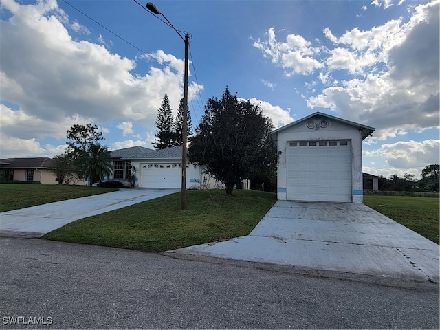 single story home with a garage and a front yard