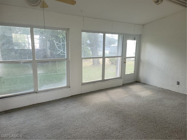 carpeted empty room with ceiling fan