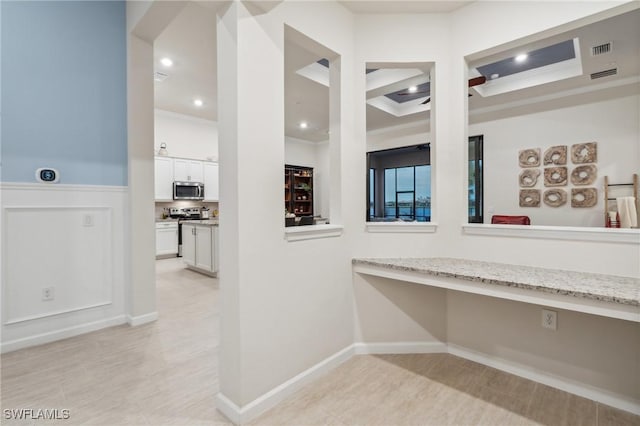 hall with recessed lighting, visible vents, and ornamental molding