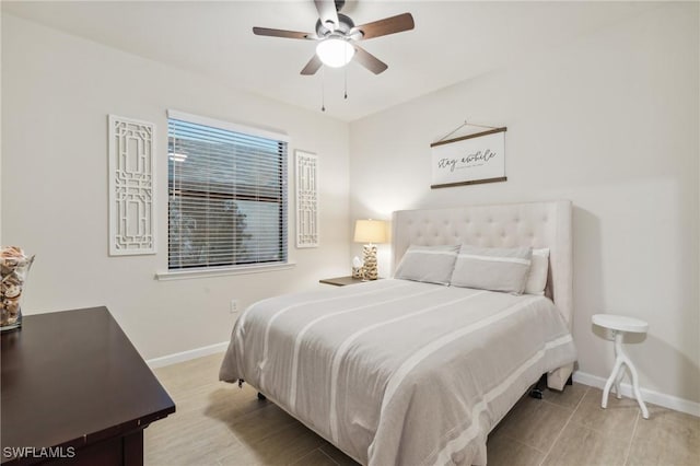 bedroom with baseboards and ceiling fan