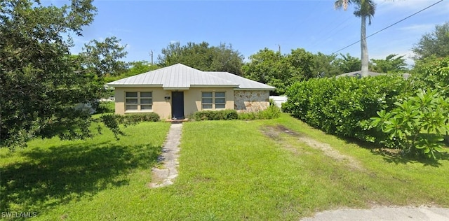 view of front of property with a front lawn