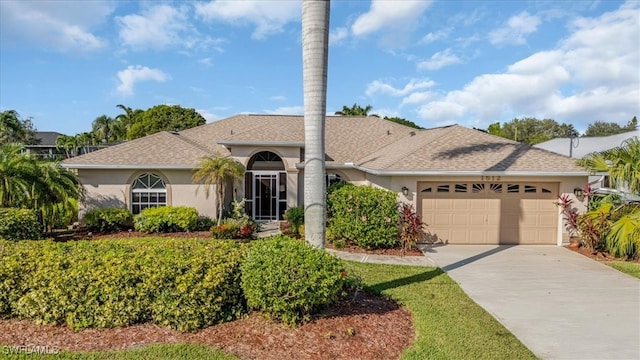 ranch-style home with a garage