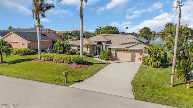 ranch-style house with solar panels, a garage, and a front lawn