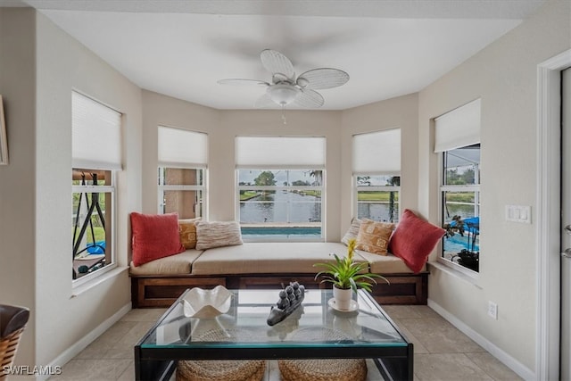 sunroom / solarium with ceiling fan and plenty of natural light