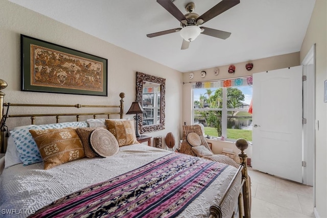 bedroom featuring ceiling fan and light tile patterned flooring